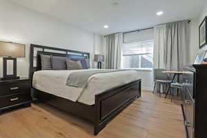 Bedroom featuring light wood finished floors and recessed lighting