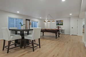 Dining area featuring light wood-style flooring, billiards table, and recessed lighting