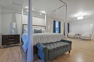 Bedroom featuring wood finished floors and recessed lighting