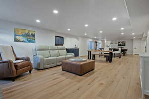 Living area featuring recessed lighting and light wood finished floors