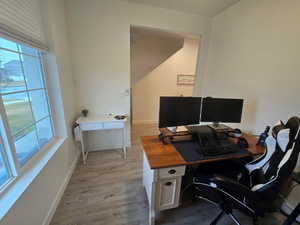 Office with light wood finished floors and baseboards
