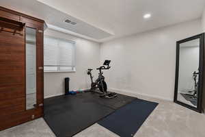 Workout room featuring carpet floors and recessed lighting