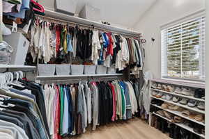Walk in closet featuring light wood-type flooring