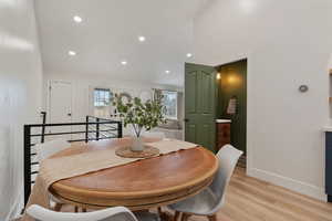 Dining room featuring light wood-style floors and recessed lighting
