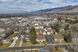 Aerial overview of property's location with mountains and nearby suburban area