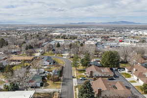 Aerial perspective of suburban area with a mountain backdrop