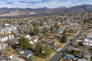 View of property location with a mountain backdrop and nearby suburban area