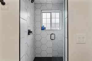 Full bath with a shower stall