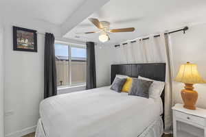 Bedroom with ceiling fan and carpet floors
