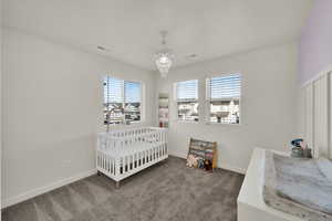 One of two additional upstairs bedrooms filled with natural light and thoughtfully positioned near the full hall bathroom.