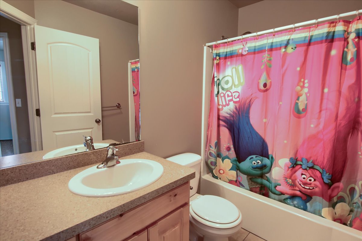 Full bathroom featuring vanity and shower / tub combo