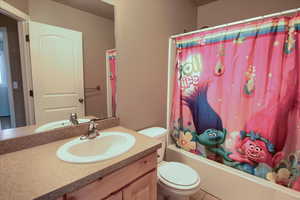 Full bathroom featuring vanity and shower / tub combo