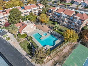 Aerial perspective of suburban area featuring a pool