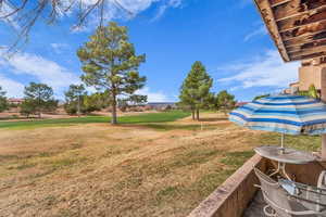 View of grassy yard featuring view of golf course
