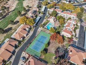 Aerial perspective of suburban area with a pool