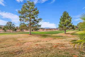 View of home's community featuring a mountain view and view of golf course