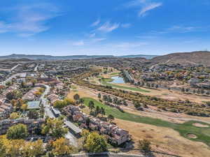 Aerial view of residential area featuring a local golf course and a water and mountain view