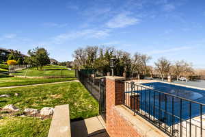 View of swimming pool with patio surround