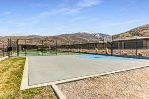 View of sport court featuring a mountain view and community basketball court