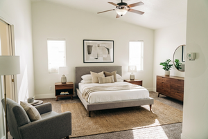 Bedroom with lofted ceiling, carpet flooring, and a ceiling fan