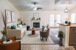 Living room featuring french doors, a ceiling fan, a glass covered fireplace, light tile patterned floors, and lofted ceiling