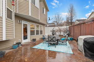 Fenced backyard with a patio