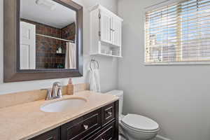Bathroom featuring vanity and tiled shower