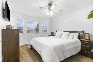 Bedroom with carpet flooring and a ceiling fan