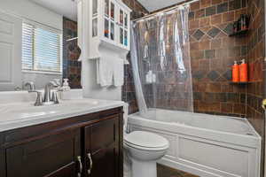 Bathroom featuring vanity and shower / bath combo