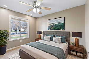 Bedroom with carpet flooring, ceiling fan, and recessed lighting