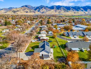 Aerial perspective of suburban area with a mountainous background