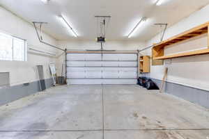 Garage featuring a garage door opener