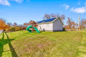 View of green lawn with a playground