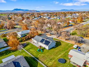 Aerial perspective of suburban area featuring a mountainous background