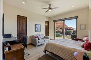 Bedroom with an office area, recessed lighting, access to exterior, a ceiling fan, and light wood-style floors