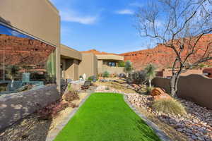 Fenced backyard with a patio