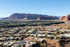 View of mountain backdrop featuring nearby suburban area