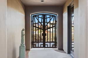 Entrance to property featuring stucco siding and french doors