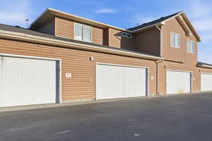 View of front of property featuring a garage