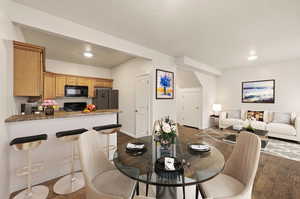 Virtual staging -Dining room with dark wood-style floors