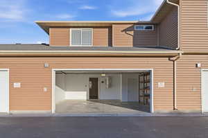 View of property with an attached garage