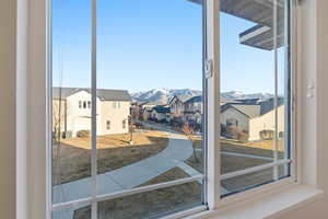 Doorway featuring a mountain view and a residential view