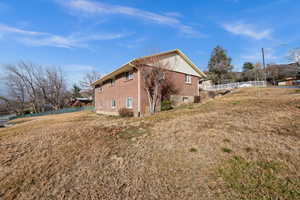 View of home's exterior featuring brick siding