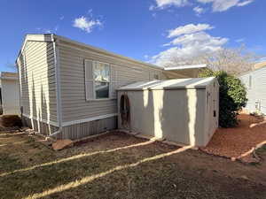 View of home's exterior featuring a shed