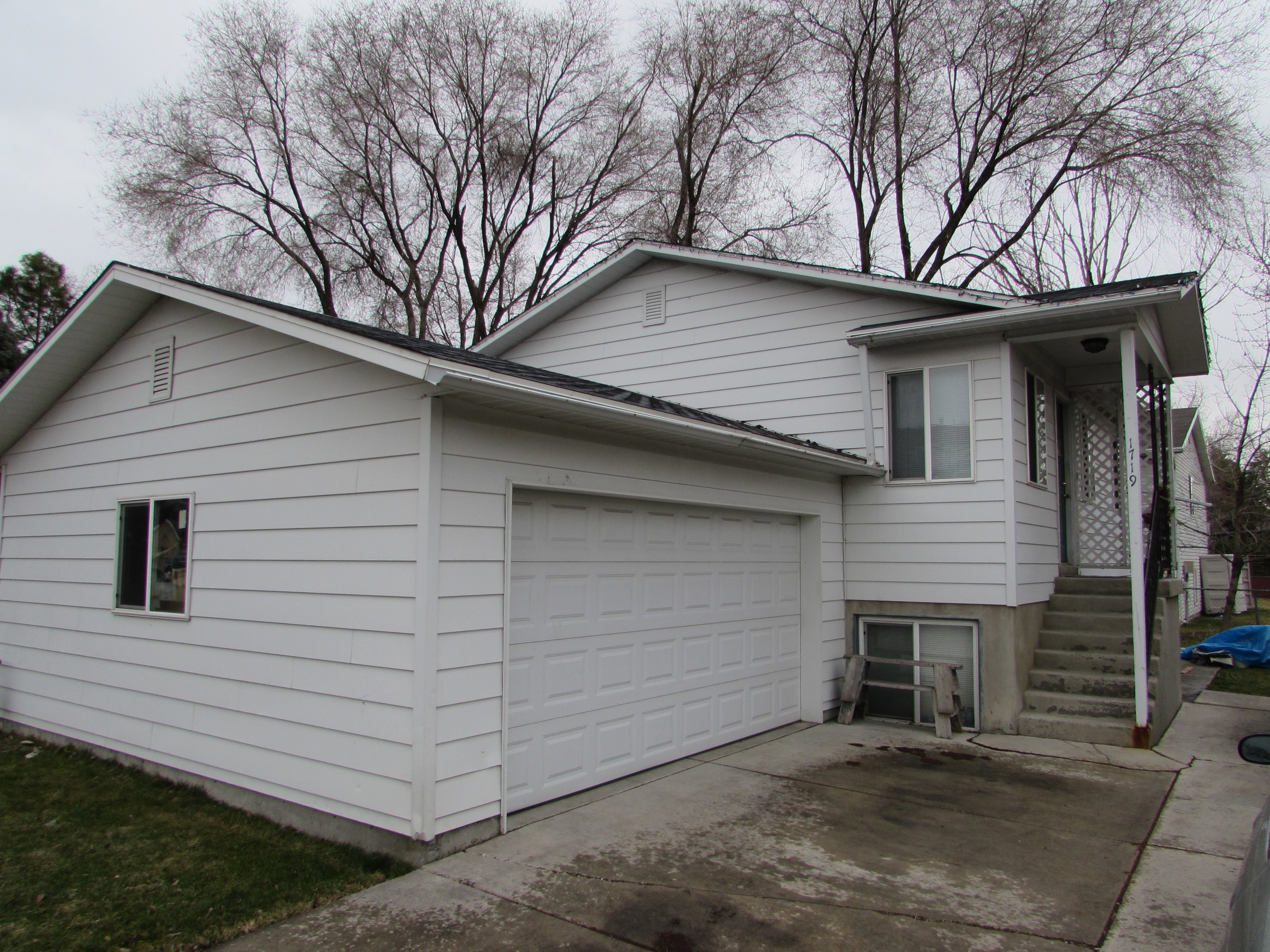 View of home's exterior with driveway and an attached garage