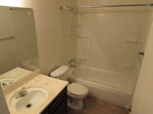 Bathroom with vanity and bathing tub / shower combination
