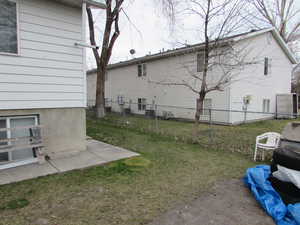 View of side of property with a patio area