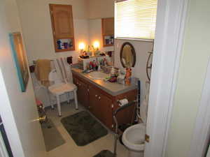 Bathroom featuring vanity and light floors