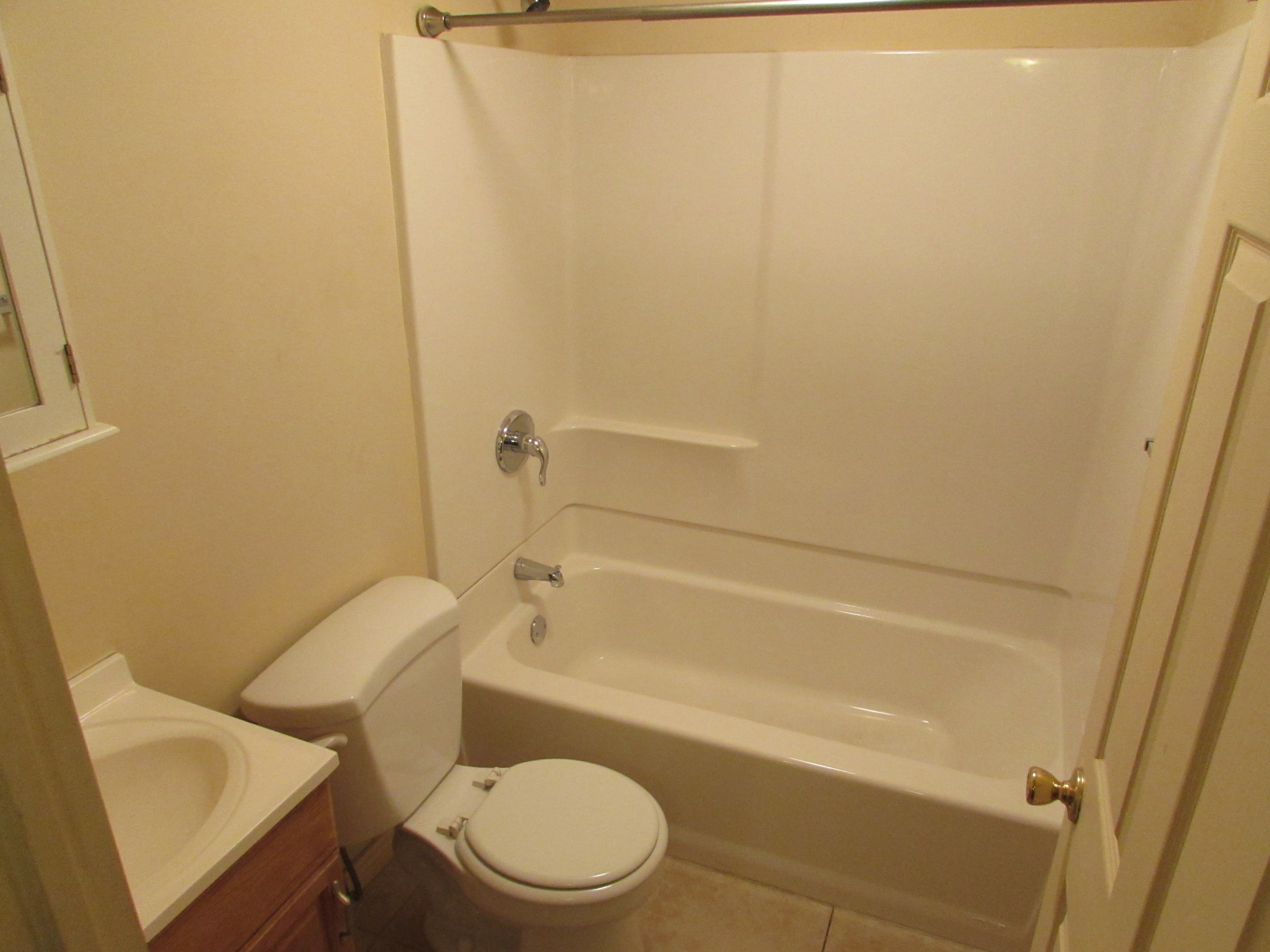 Full bath featuring vanity, tub / shower combination, and tile patterned flooring