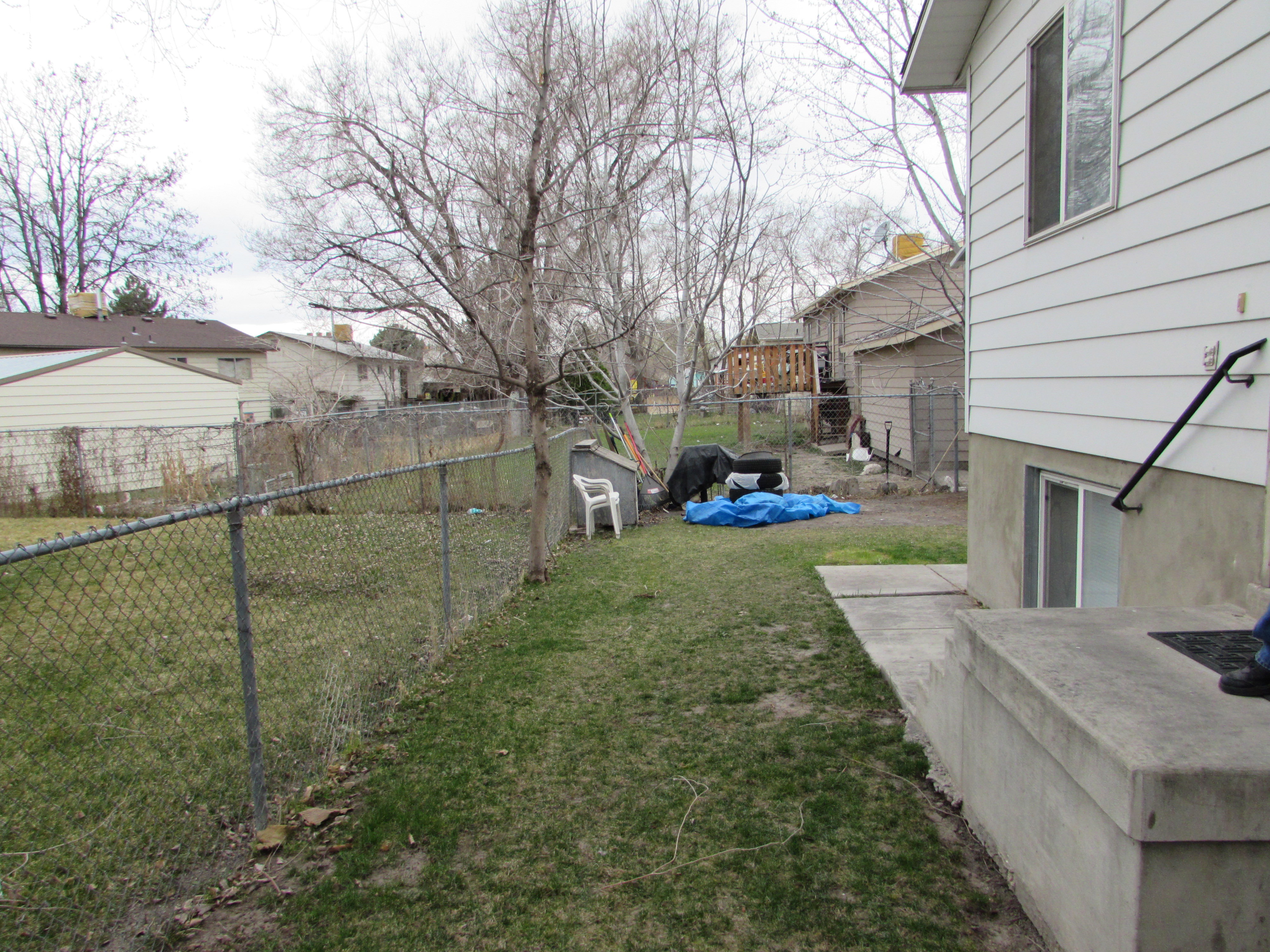 Fenced backyard featuring a patio